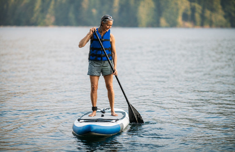 person standing on a paddleboard