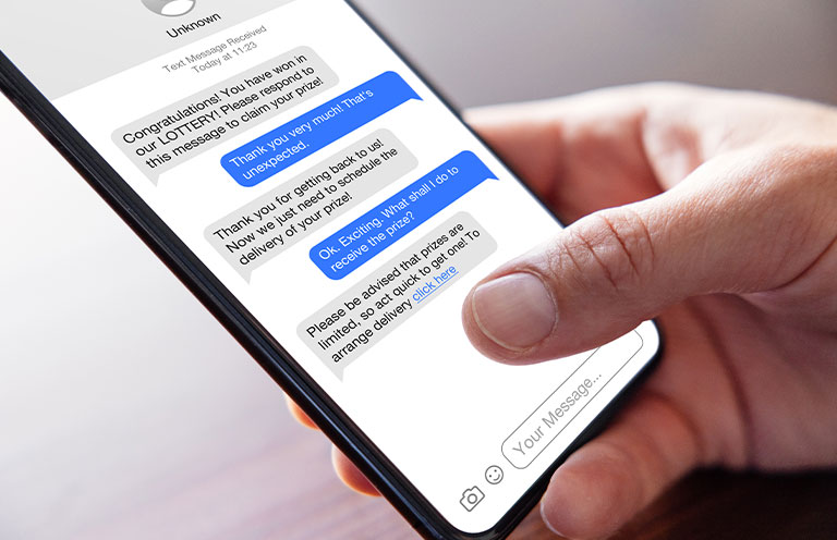 person responding to spam text message