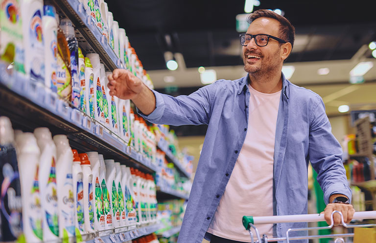 man shopping for cleaning supplies