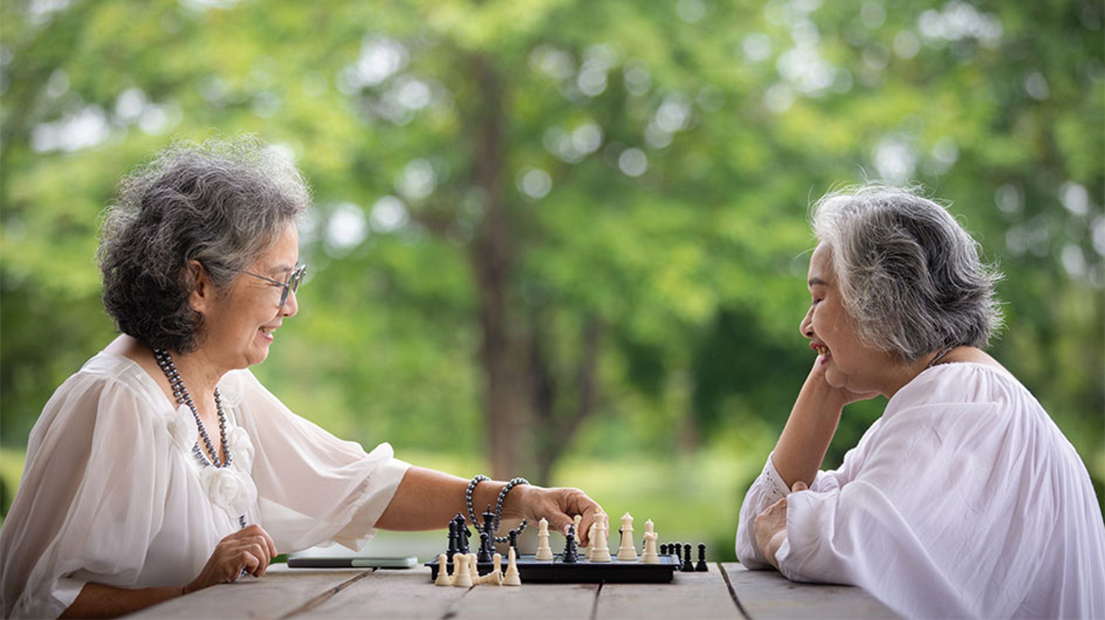 two women playing chess