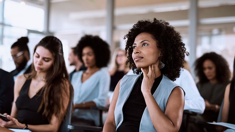 Shot of a businesswoman listening intently during a conference