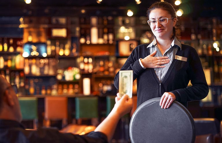 waitress receiving tip