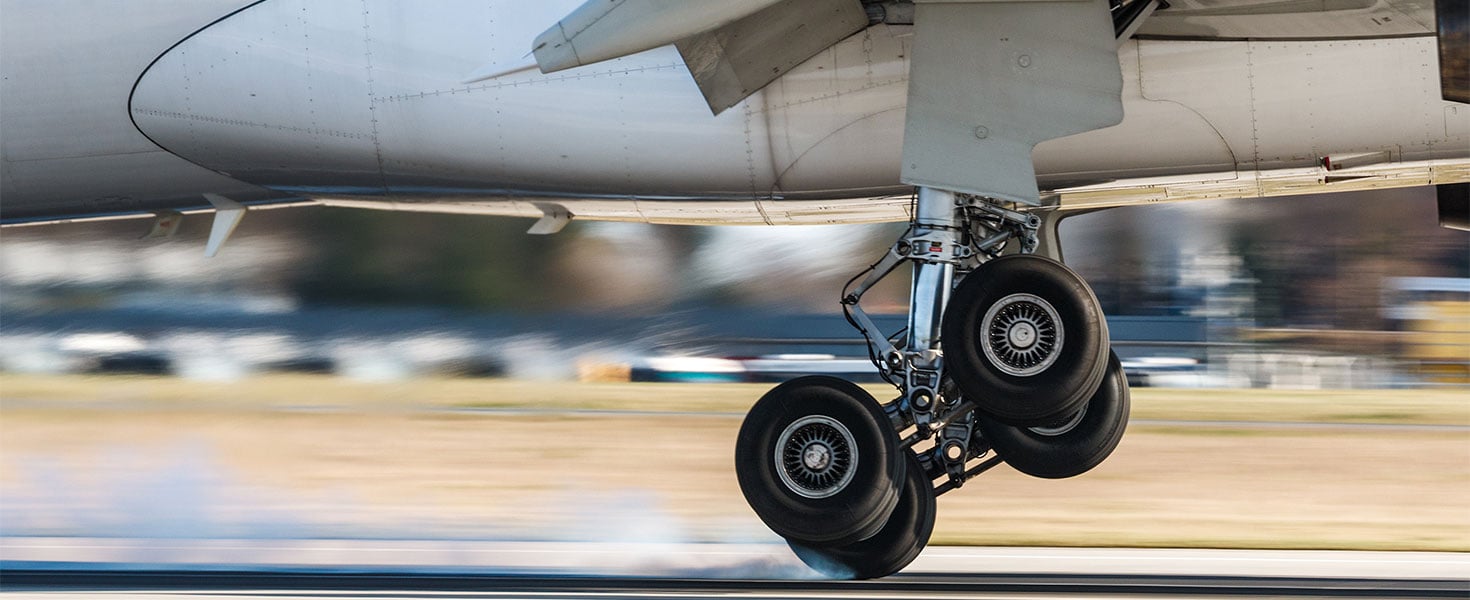 plane wheels lifting off ground