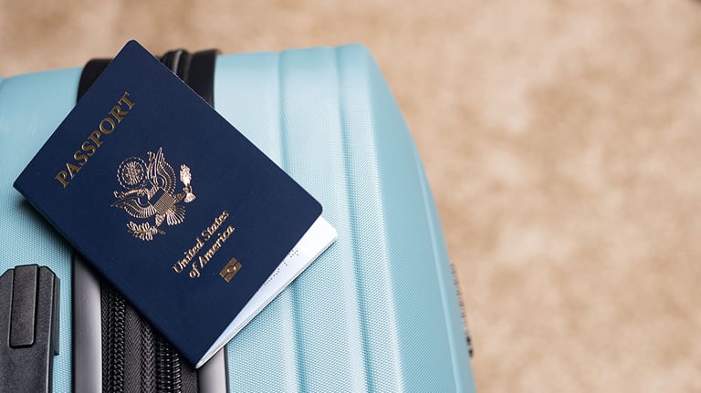 A US citizen passport placed on baggage, ready for travel.