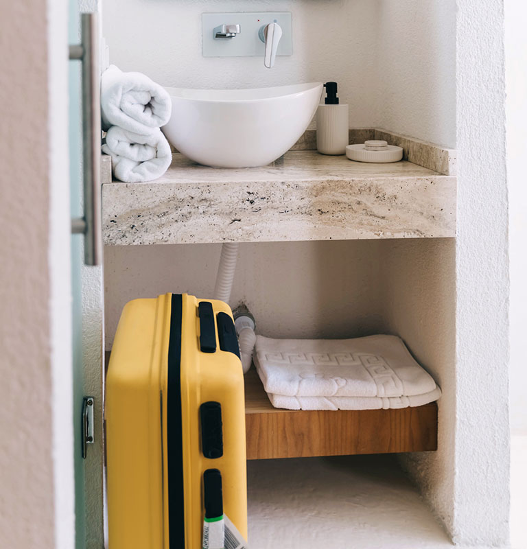 suitcase in bathroom