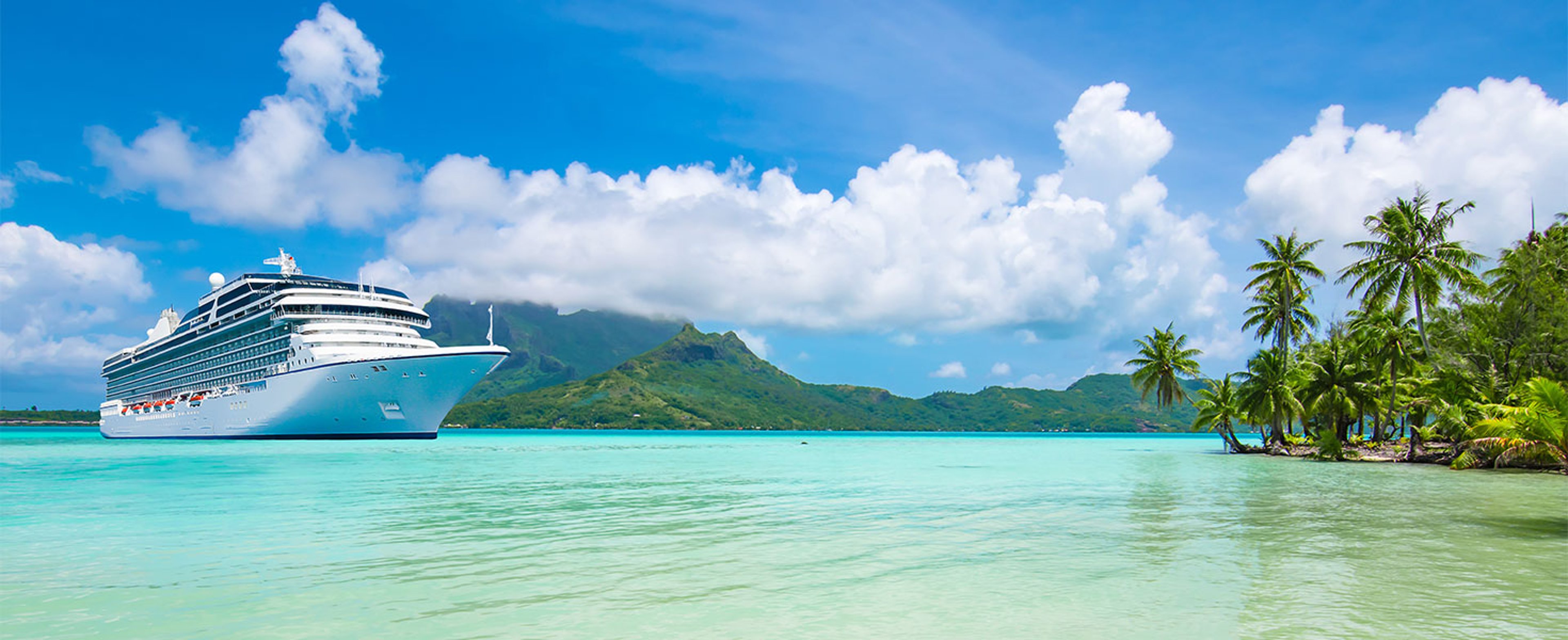 Cruise ship approaching tropical island