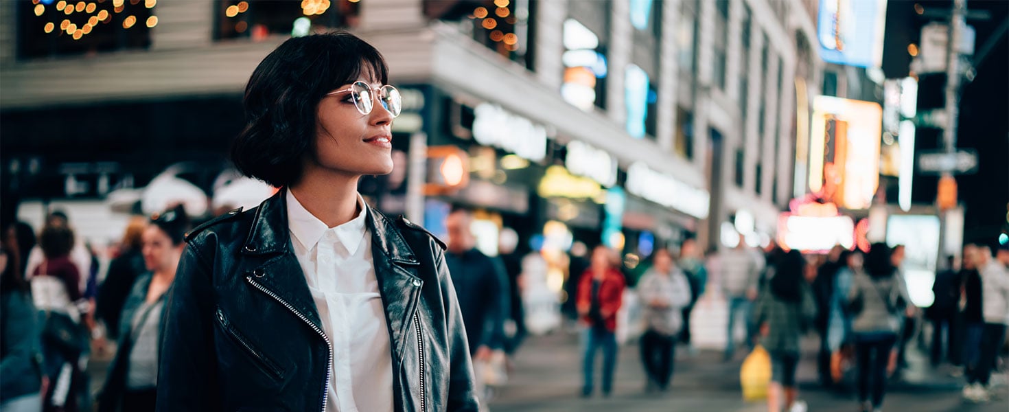 woman in city at night