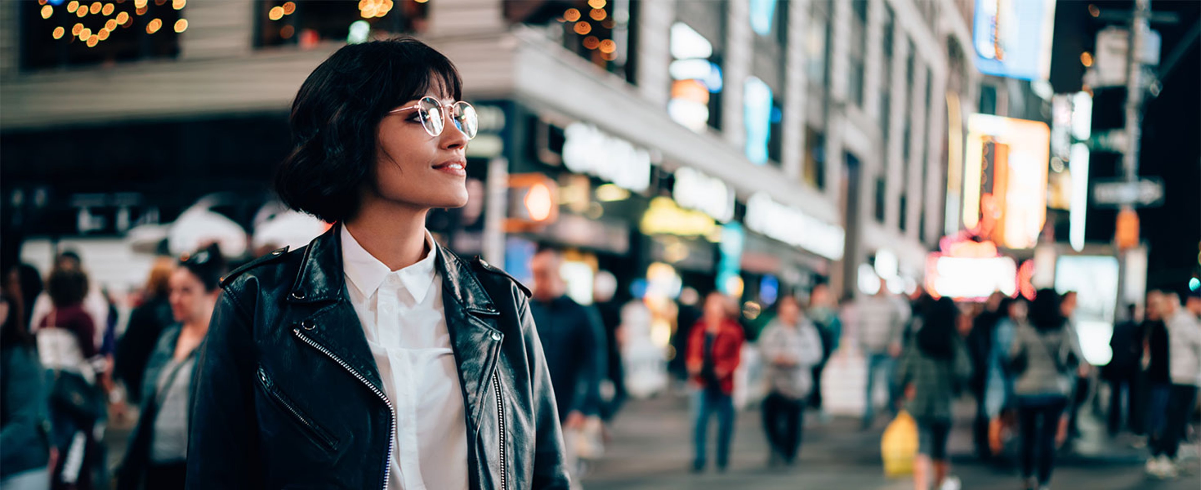 woman in city at night
