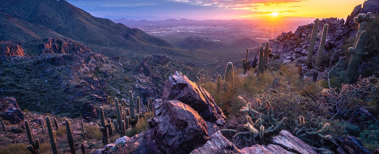 Rugged desert mountain landscape during a beautiful sunset overlooking Scottsdale, AZ. Photo by Eric Mischke