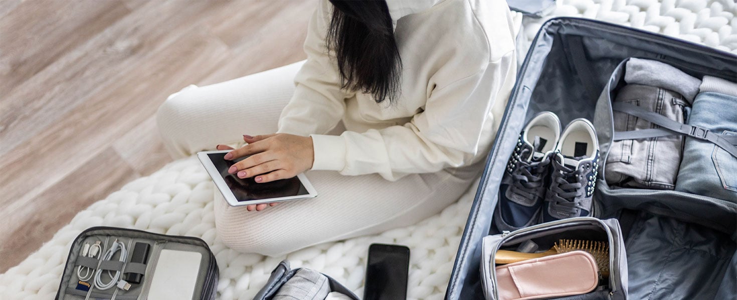 Woman packing suitcase