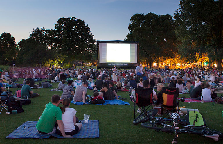 people attending at an outdoor theater