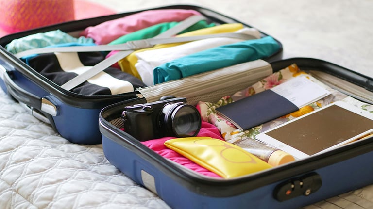 Clothes and Assorted Things in a Suitcase Credit: Kindel Media with Pexels