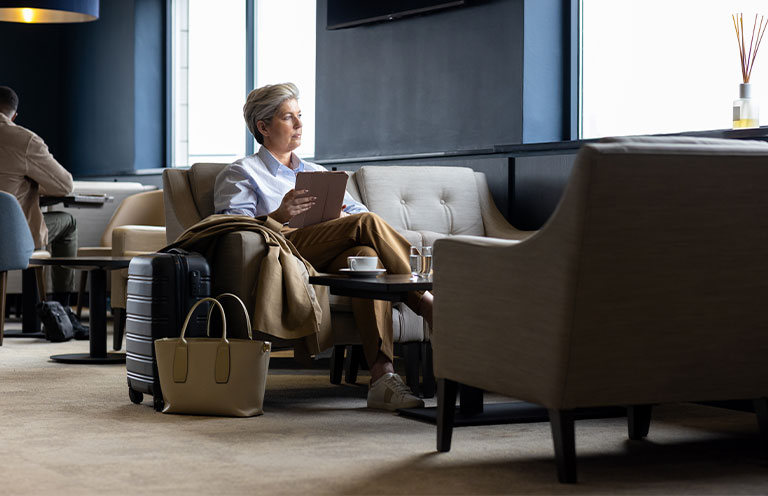 woman sitting in airport lounge