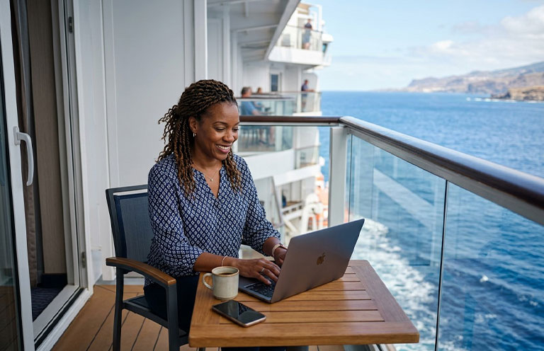woman using laptop on cruise