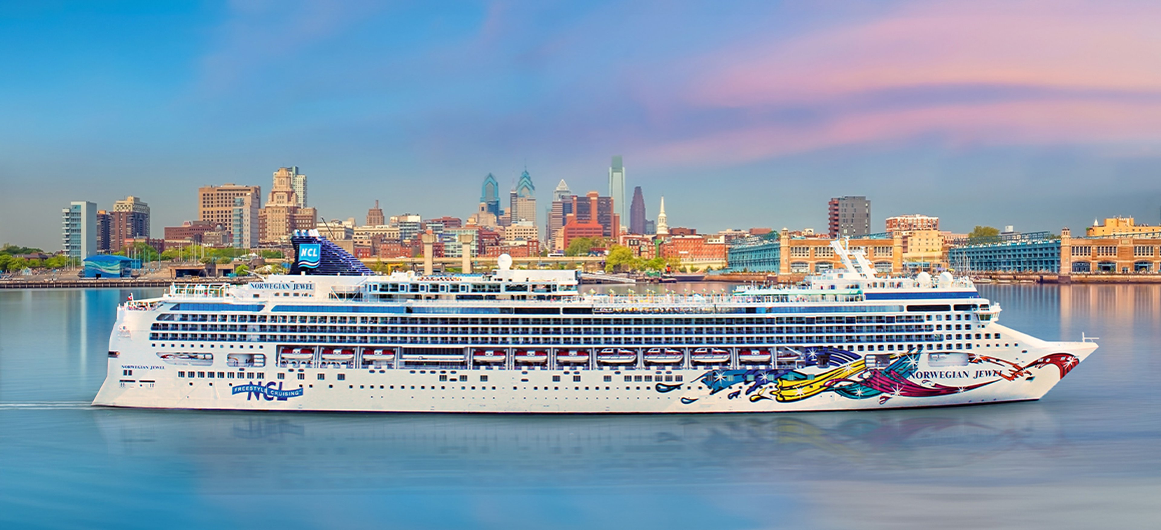 Norwegian Cruise ship sailing past Philadelphia skyline in back