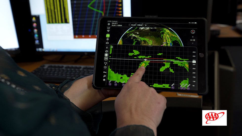 The Widget Weather app, as demonstrated by Klipfel, allows pilots to view turbulence reports in real time. Photo by Josh Purnell.