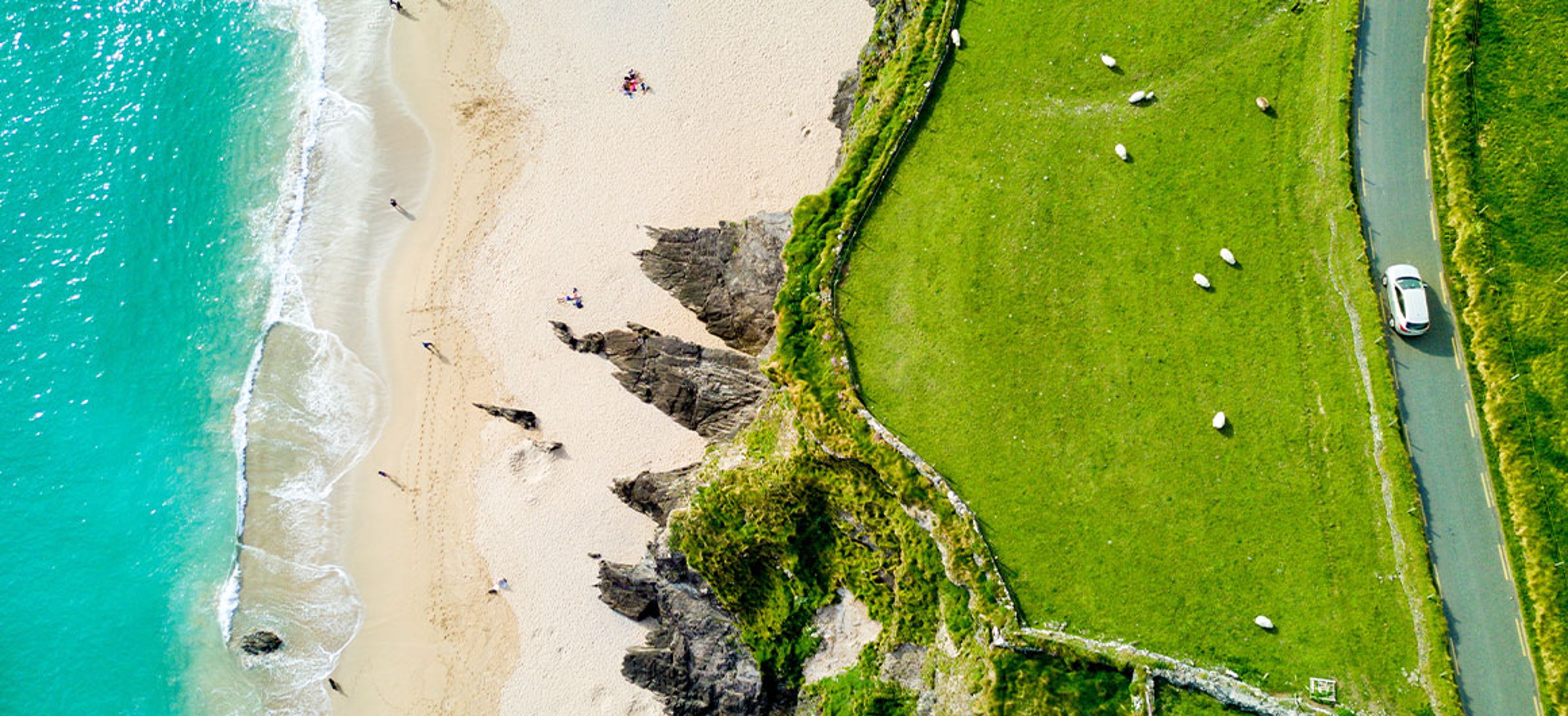 Car Driving Past Coumeenoole Bay, Dingle Peninsula, Ireland 
