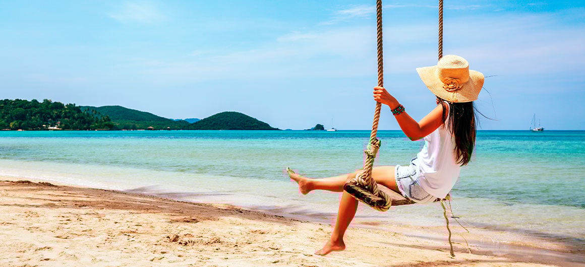 woman on swing at the beach