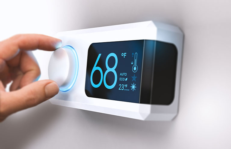 person setting the thermostat