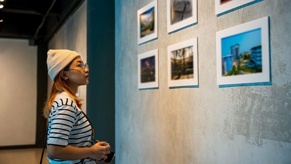 girl looking at exhibit at museum