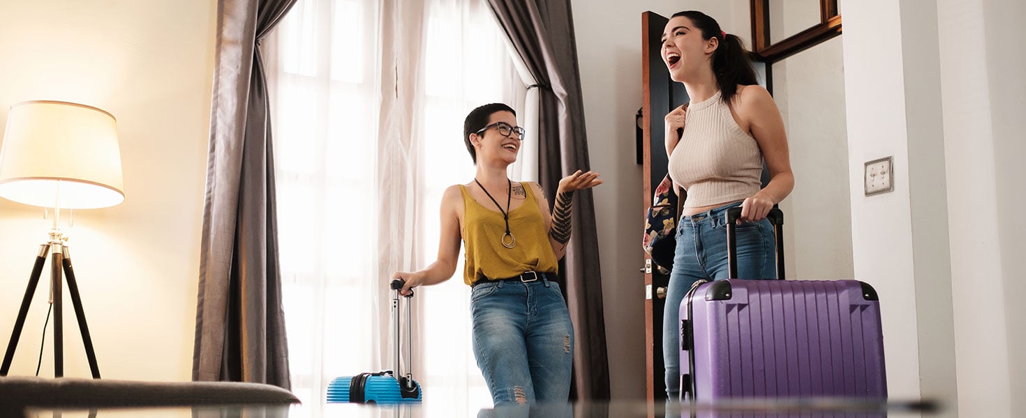 Excited Travel Partners Arriving to Great Bed and Breakfast Location By engagestock