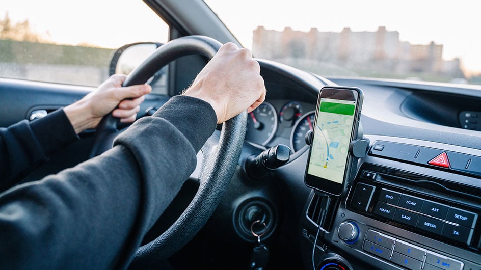 Phone with GPS mounted to car dashboard