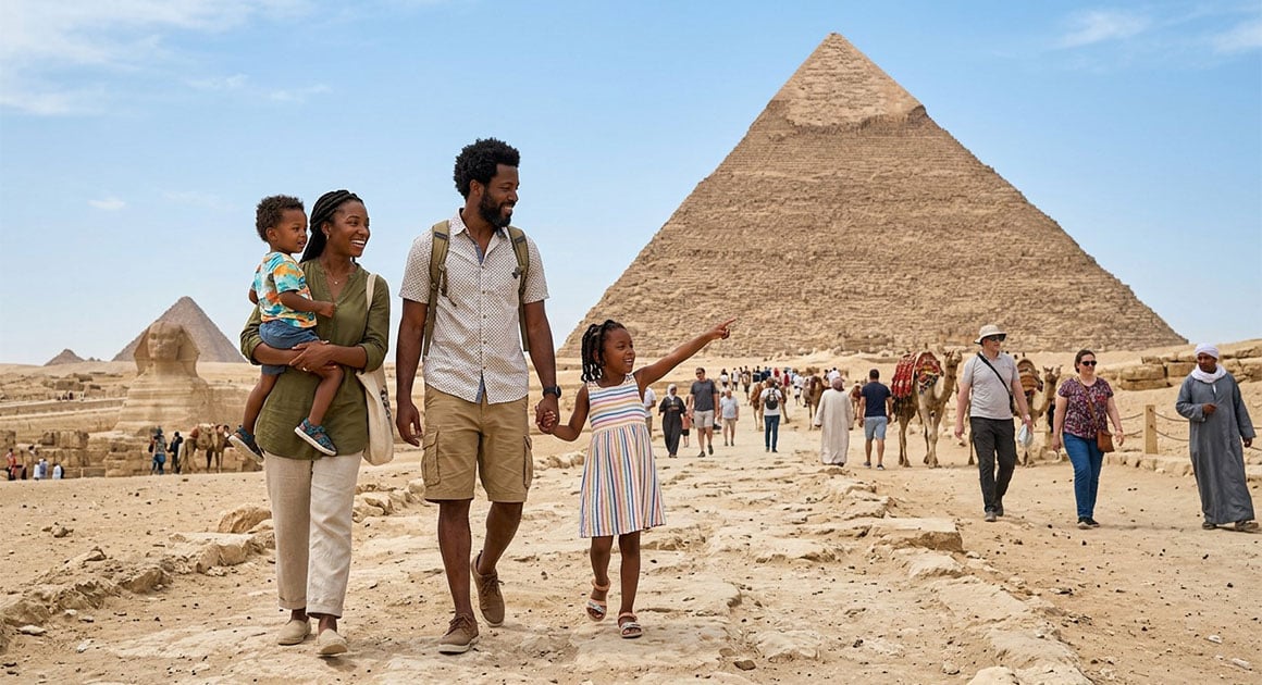 Mother father and kids walk in front of pyramids in Egypt