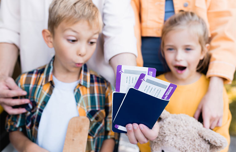 kids with passport and tickets