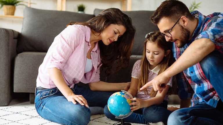 Family looking at globe