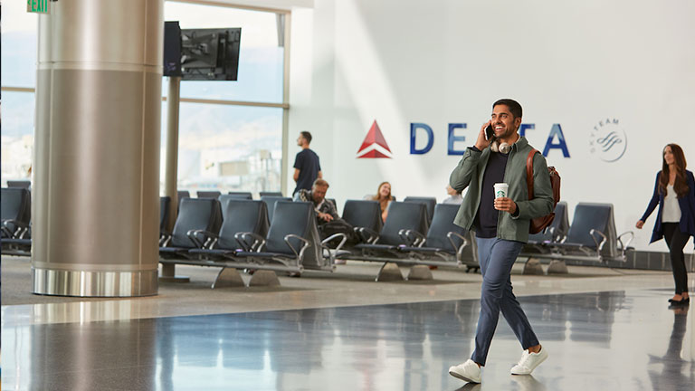 Customer in the airport; Courtesy of Delta	