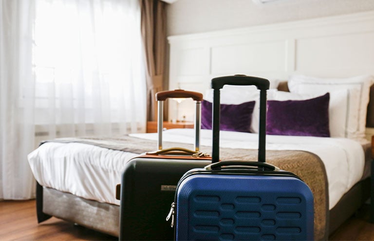 suitcases in hotel room