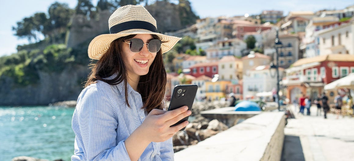 woman using phone on vacation