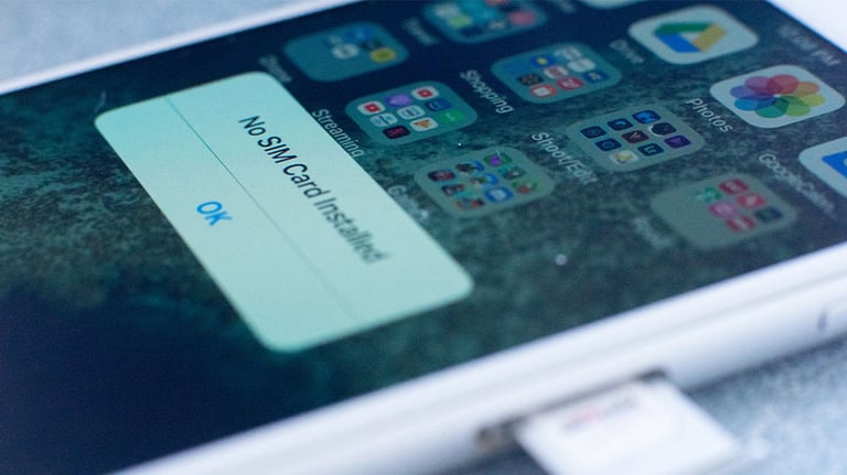 sim card tray being ejected from phone