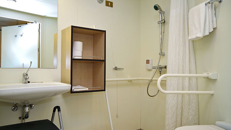 Wheelchair accessible bathroom with shower aboard cruise ship or cruise ship liner By Tamme Wichmann