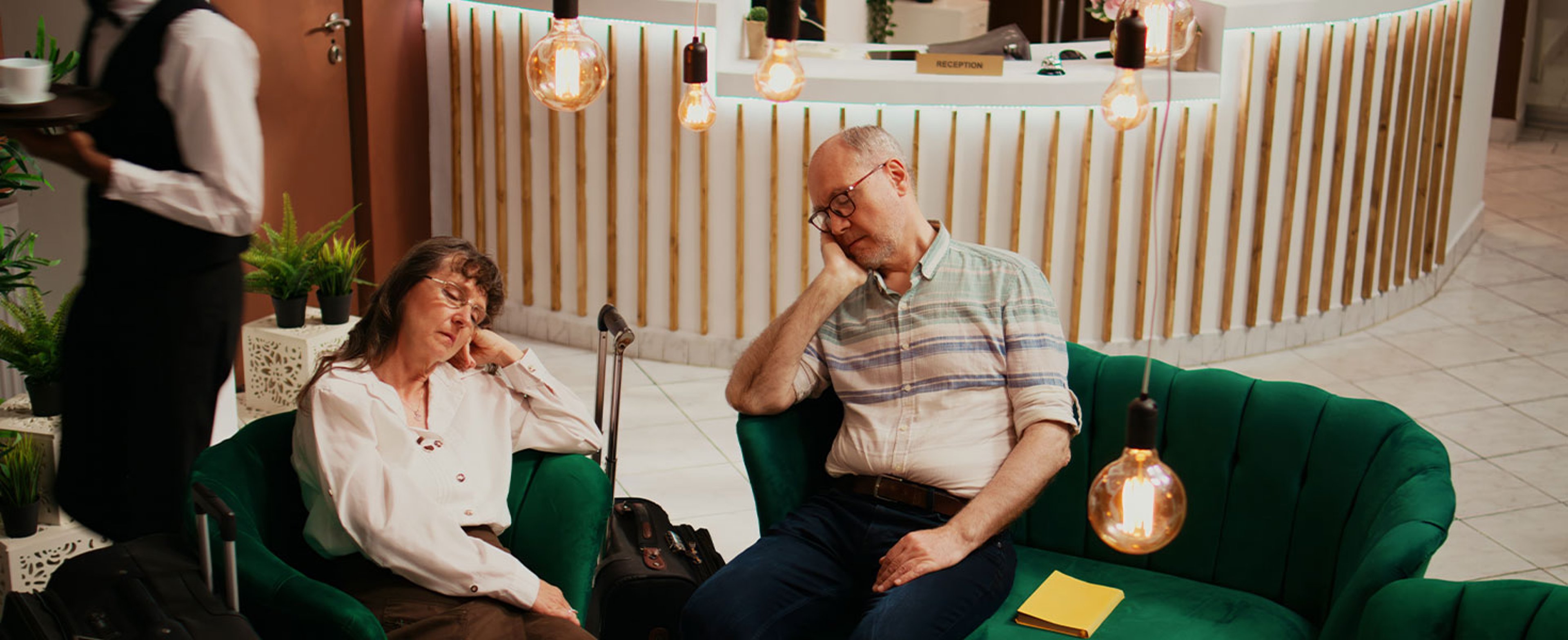 man and woman sleeping in hotel lobby