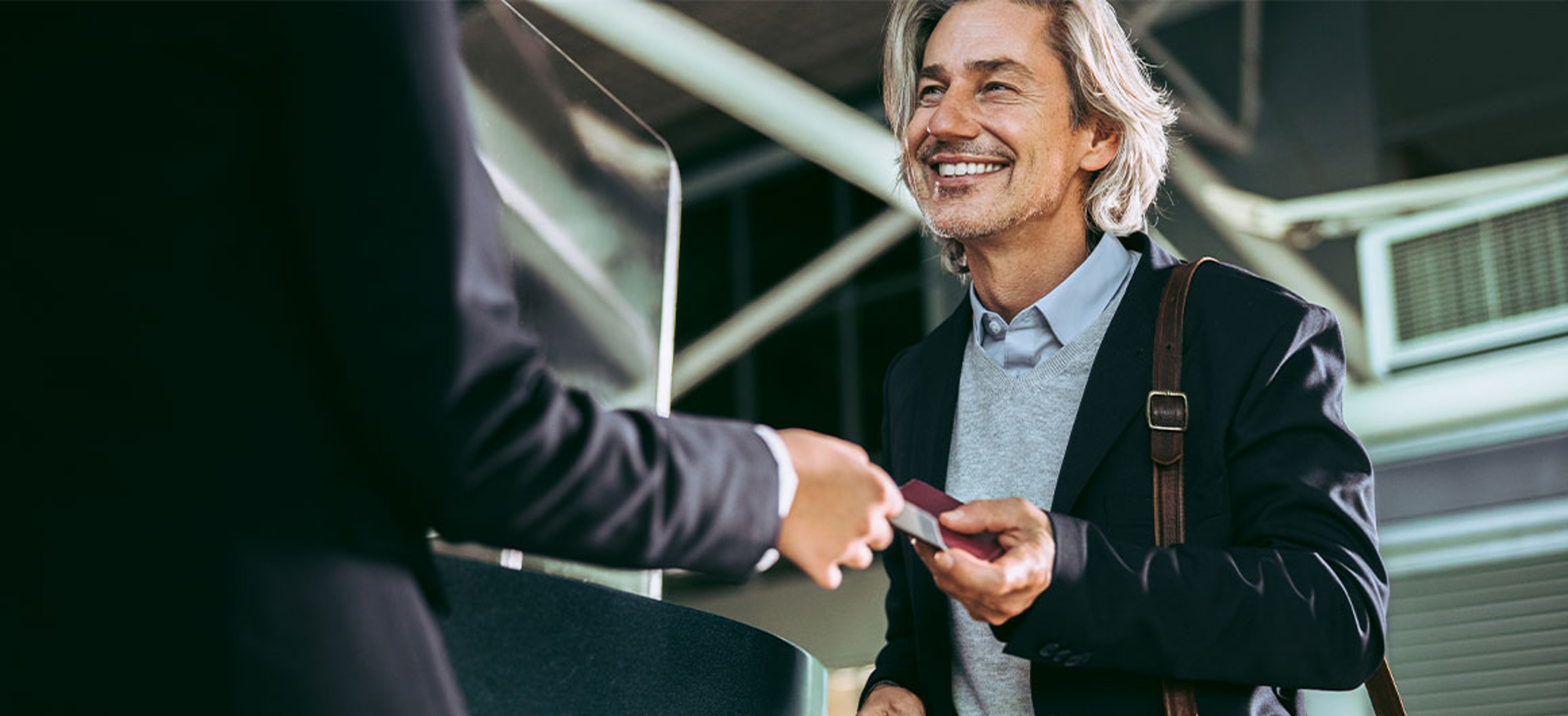 man handing person ID