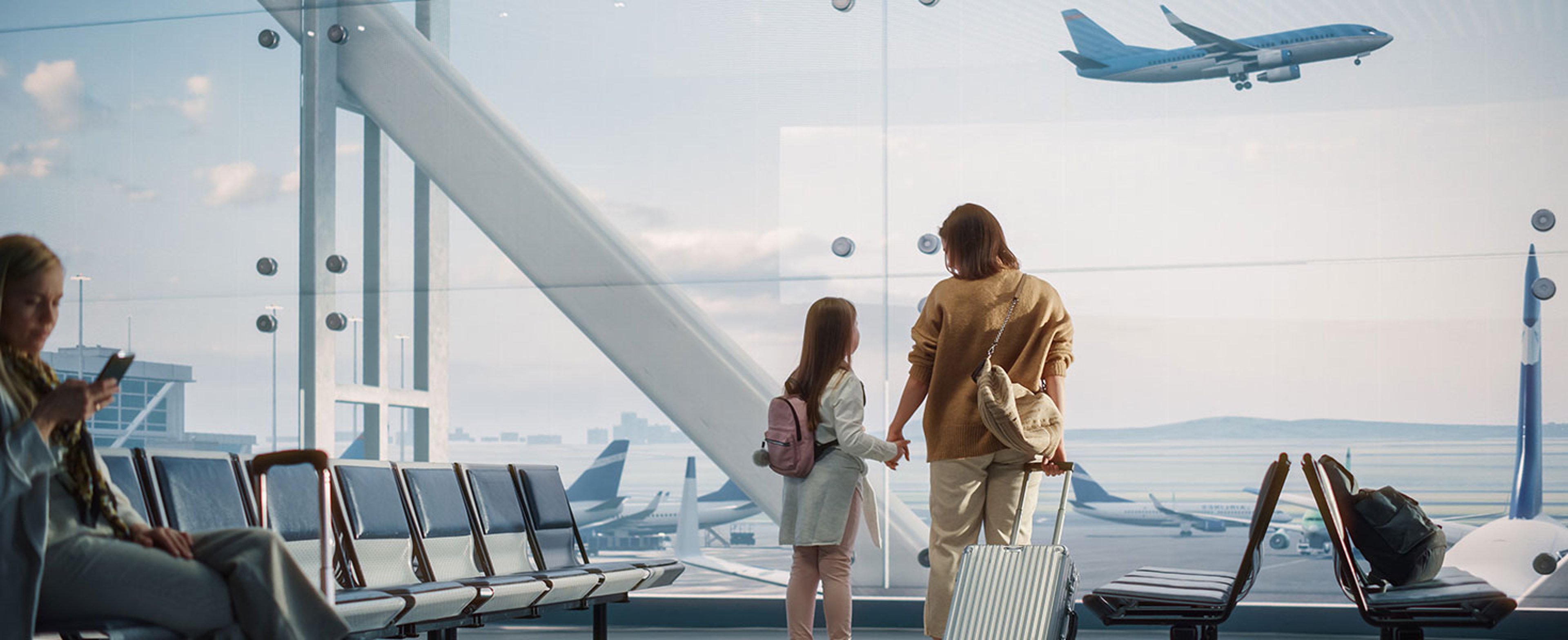 Airport Terminal: Beautiful Mother and Cute Little Daughter Wait for their Vacation Flight, Looking out of Window for Arriving and Departing Airplanes. Young Family in Boarding Lounge of Airline Hub by Gorodenkoff