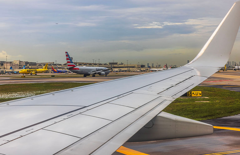 multiple planes from different airlines at airport