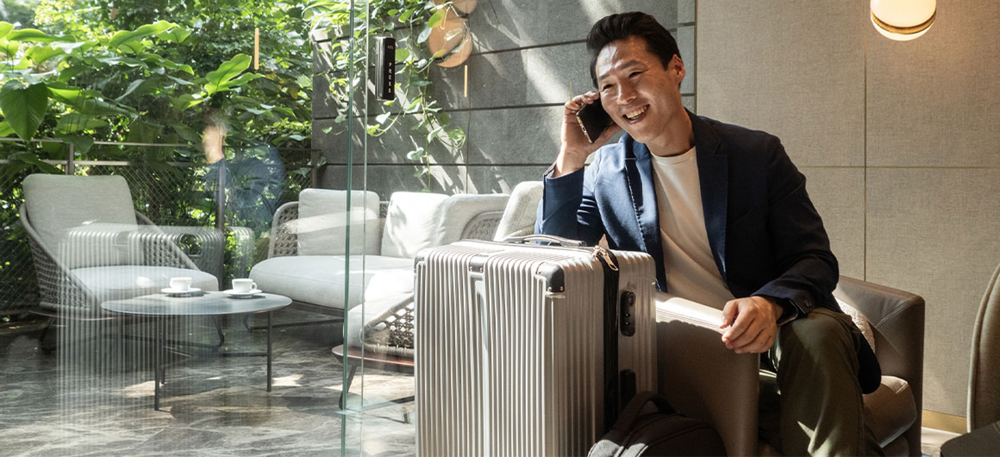 man on phone in airport lounge