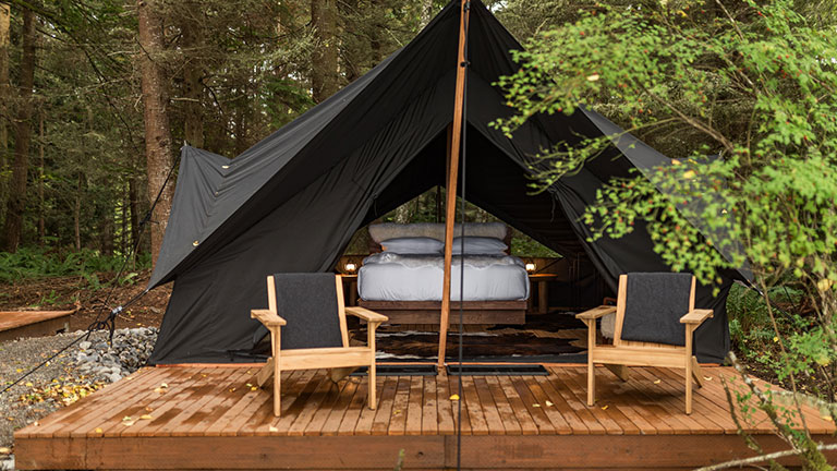 Blackout glamping tents at Menizei offer deep rest amid the towering trees of the Olympic Peninsula; photo courtesy of Menizei