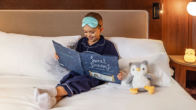 The Royal Sonesta Benjamin’s Little Royals Sleep Program helps kids wind down with cozy touches like sleep masks and bedtime books; photo courtesy of Royal Sonesta Benjamin Hotel