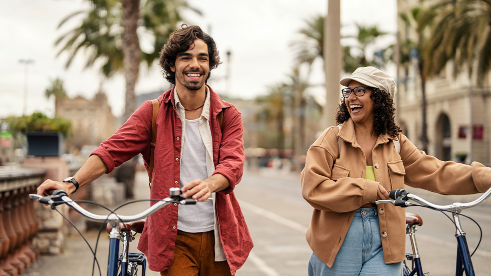 A couple walking with bikes