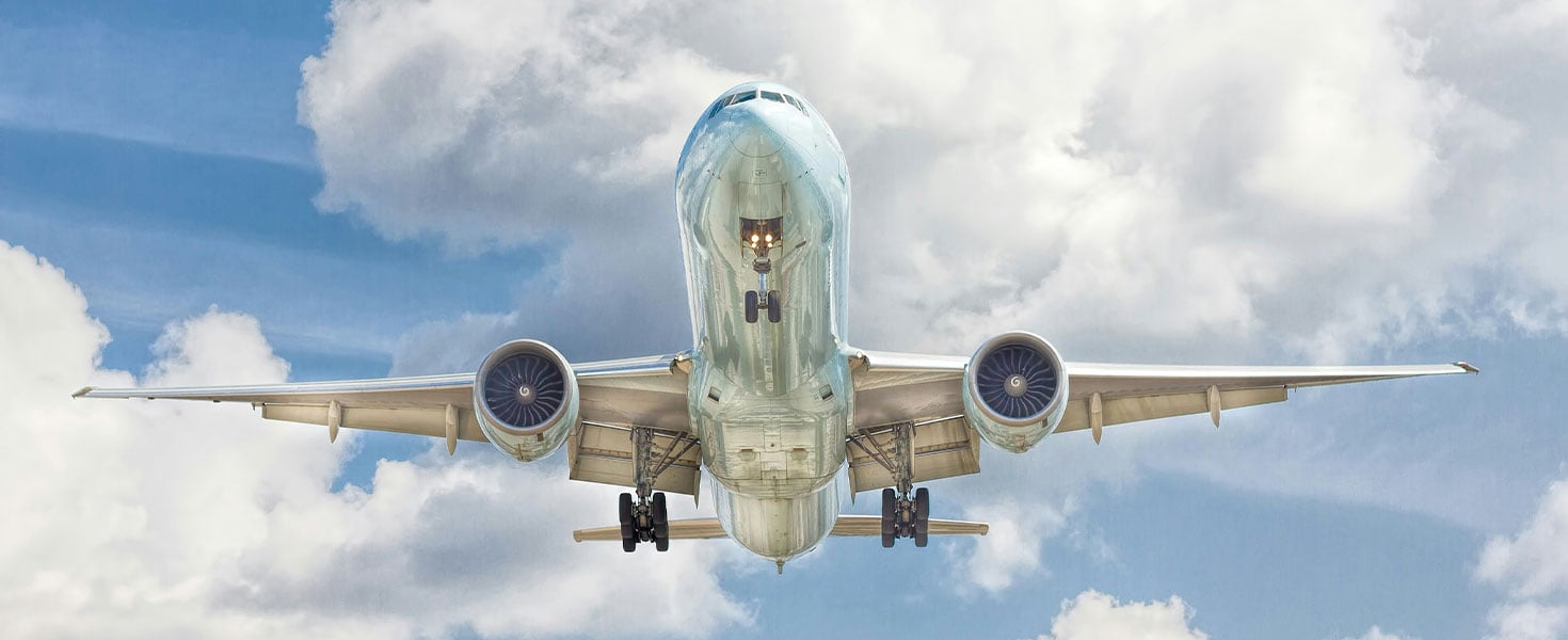 View of bottom of plane in sky