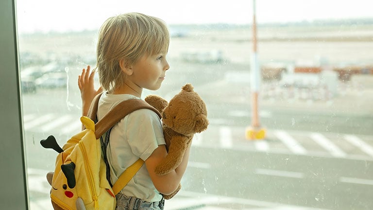 Kid-size backpack or carry-on suitcase