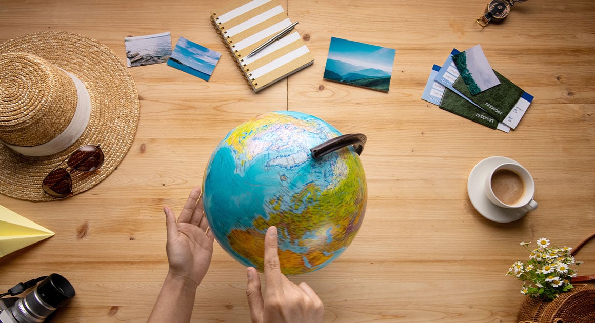 travel concept with a globe, passport, and travel accessories