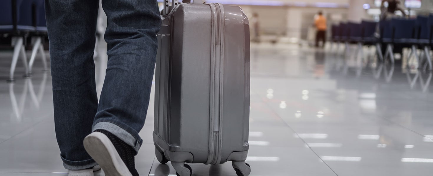 Traveler passenger hold luggage at terminal airport or transit flight with suitcase in journey vacation holiday at arrival international, No people in transportation during covid19 virus pandemic More by smolaw11