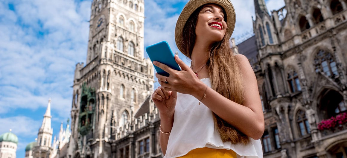 girl on phone smiling, in Europe