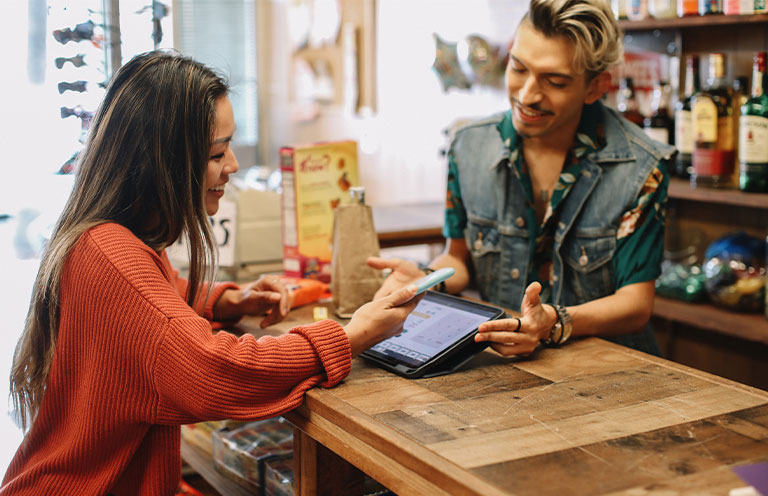 woman making purchase in store