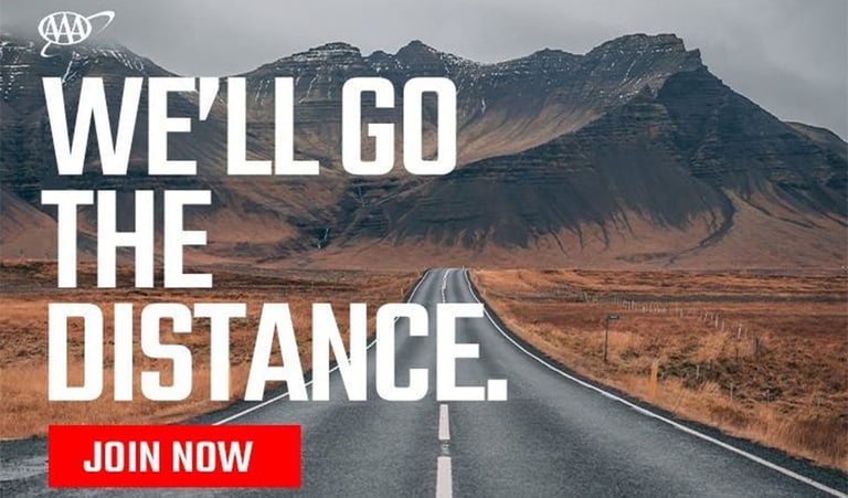 empty highway with mountains in the background; we'll go the distance