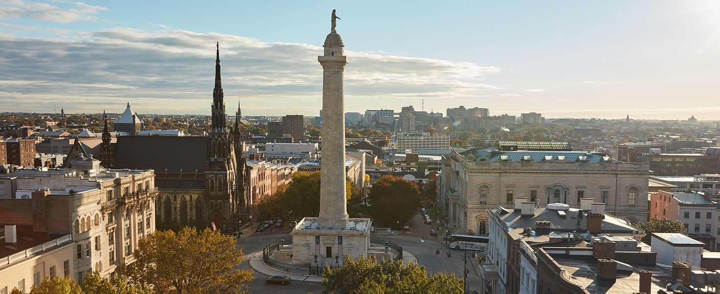 A stunning view of Baltimore's iconic Washington Monument, framed by the city's charm and history; Photo by Jason Varney, courtesy of Visit Baltimore
